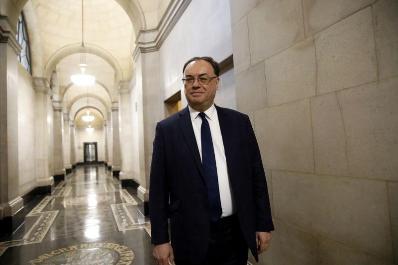 &copy; Reuters. Bank of England Governor Andrew Bailey poses for a photograph on the first day of his new role at the Central Bank in London, Britain March 16, 2020. Tolga Akmen/Pool via REUTERS/File Photo