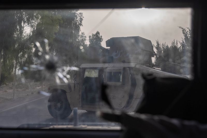 © Reuters. A humvee belonging Afghan Special Forces is seen destroyed during heavy clashes with Taliban during the rescue mission of a police officer besieged at a check post, in Kandahar province, Afghanistan, July 13, 2021. REUTERS/Danish Siddiqui