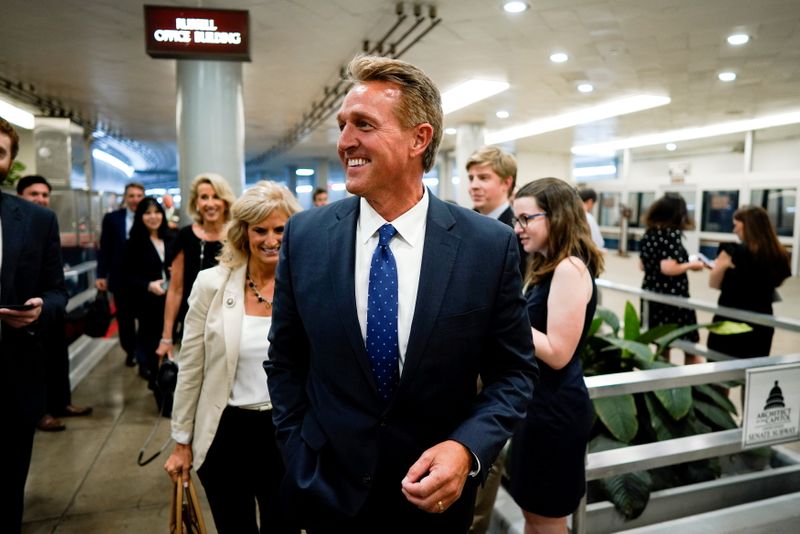 &copy; Reuters. FILE PHOTO: Former Sen. Jeff Flake (R-AZ) speaks with reporters ahead of the weekly policy luncheons on Capitol Hill in Washington, U.S., May 7, 2019. REUTERS/Aaron P. Bernstein/File Photo