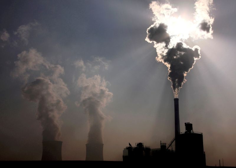 &copy; Reuters. FILE PHOTO: A coal-burning power plant can be seen behind a factory in China's Inner Mongolia Autonomous Region, October 31, 2010.  REUTERS/David Gray