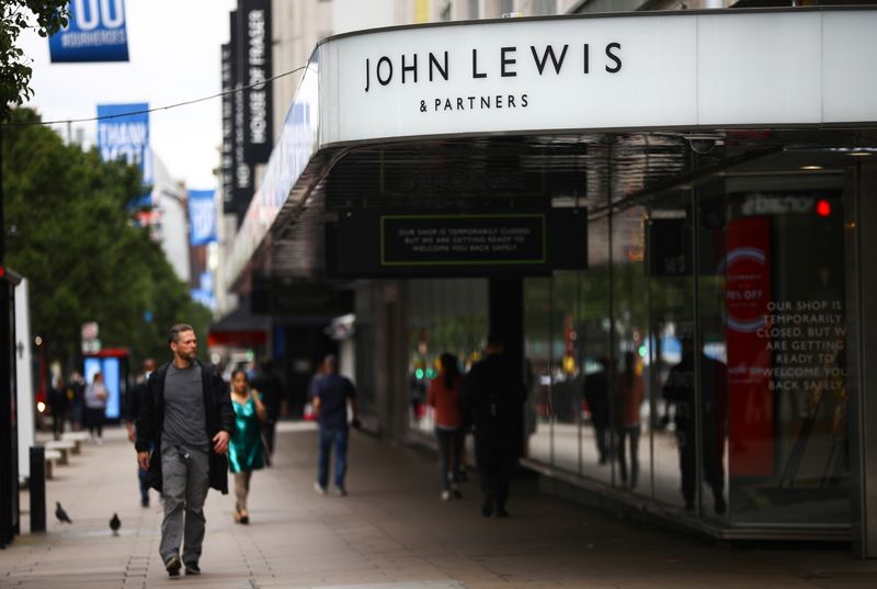 &copy; Reuters. FILE PHOTO: A man walks past the John Lewis & Partners store at the Oxford Street, in London, Britain July 2, 2020. REUTERS/Hannah McKay