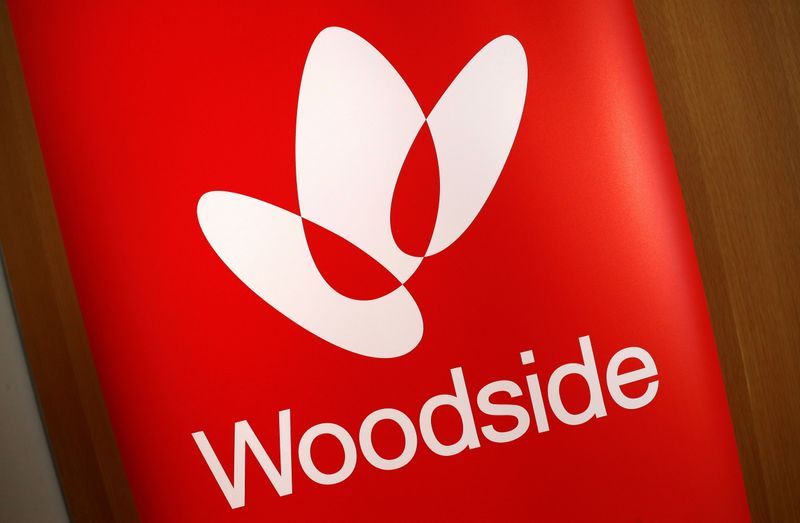 &copy; Reuters. FILE PHOTO: The logo for Woodside Petroleum, Australia's top independent oil and gas company, adorns a promotional poster on display at a briefing for investors in Sydney, Australia, May 23, 2018.   REUTERS/David Gray/File Photo/File Photo