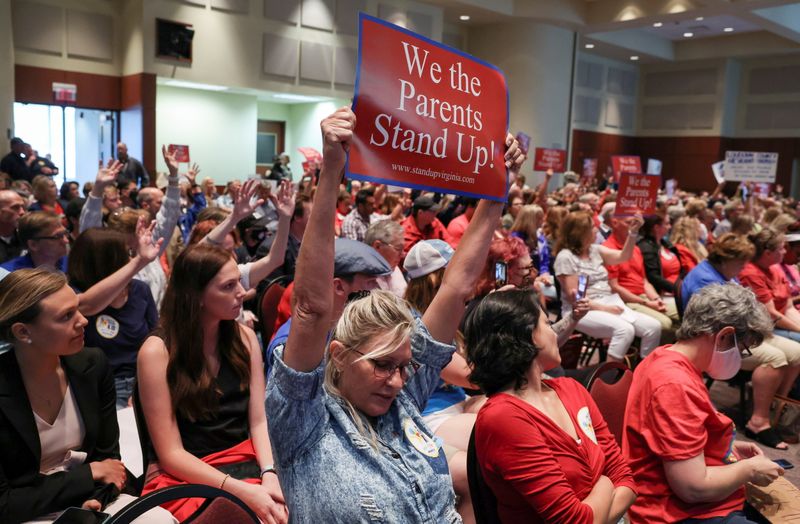 &copy; Reuters. FILE PHOTO: Parents and community members attend a Loudoun County School Board meeting which included a discussion about the academic doctrine known as Critical Race Theory, in Ashburn, Virginia, U.S.  June 22, 2021. REUTERS/Evelyn Hockstein/File Photo