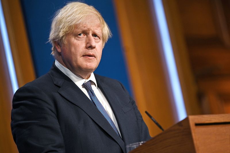 &copy; Reuters. FILE PHOTO: Britain's Prime Minister Boris Johnson looks on at a news conference as he gives an update on relaxing restrictions imposed on the country during the coronavirus disease (COVID-19) pandemic inside the Downing Street Briefing Room in London, Br