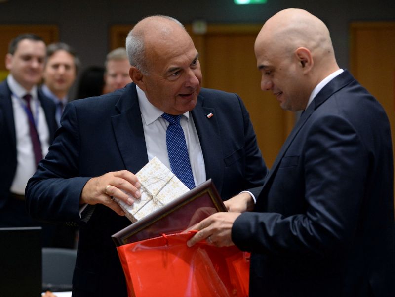 &copy; Reuters. FILE PHOTO: Poland's finance minister Tadeusz Koscinski and British Chancellor of the Exchequer Sajid Javid attend an European Union finance ministers meeting in Brussels, Belgium January 21, 2020. REUTERS/Johanna Geron/File Photo