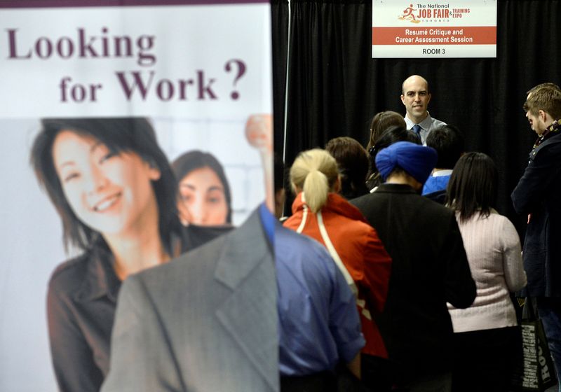 &copy; Reuters. FILE PHOTO: People wait in line for resume critique and career assessment sessions at the 2014 Spring National Job Fair and Training Expo in Toronto, April 3, 2014. REUTERS/Aaron Harris