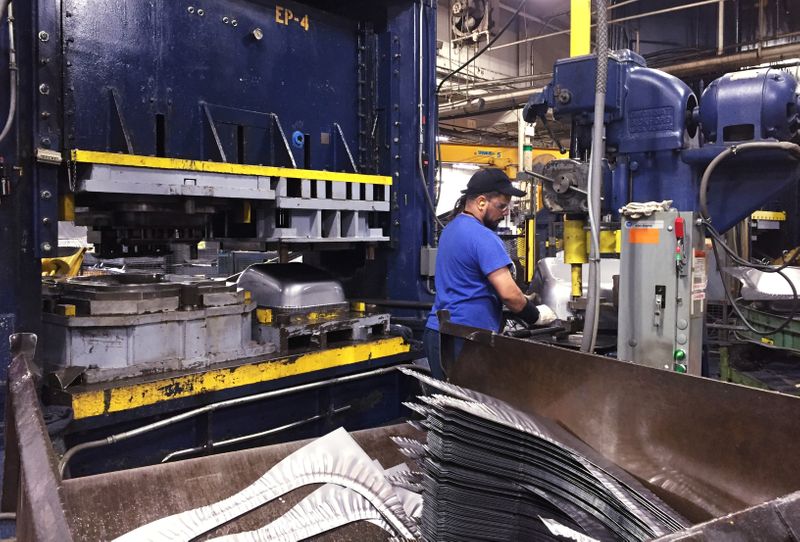 &copy; Reuters. FILE PHOTO: A production line employee works at the AMES Companies factory, the largest wheelbarrow factory in the world, in Harrisburg, Pennsylvania, U.S. on June 29, 2017.  REUTERS/Tim Aeppel