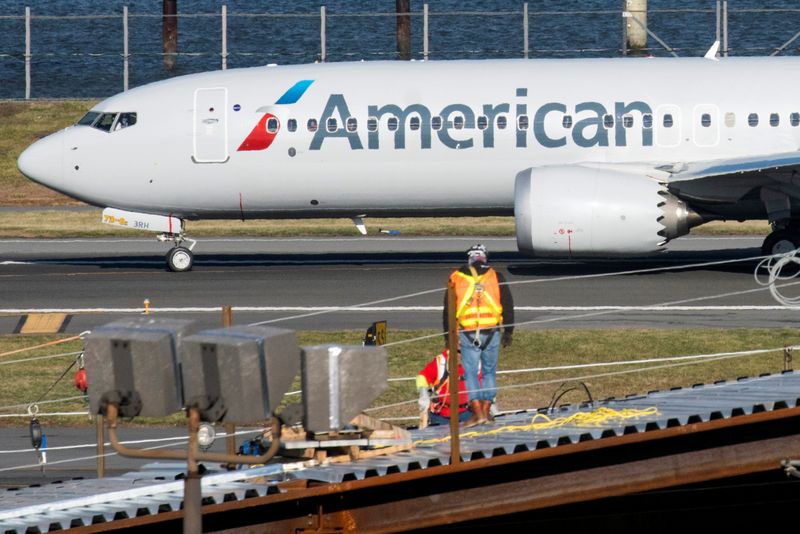 &copy; Reuters. FILE PHOTO: American Airlines flight 718, the first U.S. Boeing 737 MAX commercial flight since regulators lifted a 20-month grounding in November, lands at LaGuardia airport in New York, U.S. December 29, 2020.  REUTERS/Eduardo Munoz