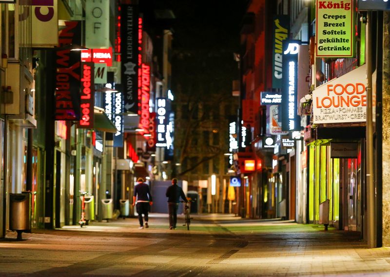 &copy; Reuters. FILE PHOTO: People walk down the empty Hohe Strasse shopping district during a night-time curfew, amid the coronavirus disease (COVID-19) pandemic, in Cologne, Germany, May 8, 2021. REUTERS/Thilo Schmuelgen