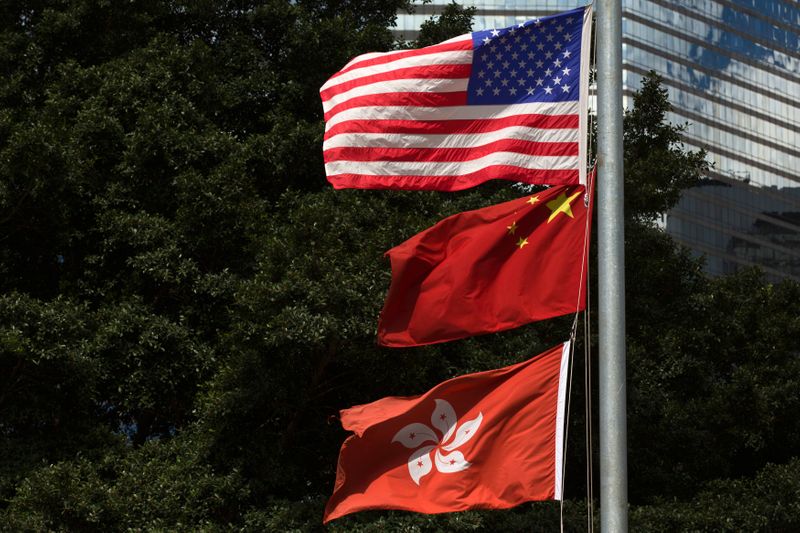 &copy; Reuters. FILE PHOTO: Flags of China, Hong Kong and the U.S. fly next to each other along Fenwick Pier, in Hong Kong June 27, 2013.  REUTERS/Tyrone Siu 