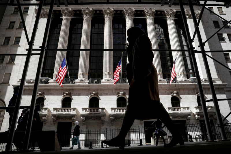 &copy; Reuters. FILE PHOTO: People are seen outside the New York Stock Exchange (NYSE) in New York City, U.S., March 19, 2021.  REUTERS/Brendan McDermid/File Photo