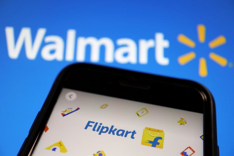 &copy; Reuters. FILE PHOTO: A mobile phone showing an image of Indian online retailer Flipkart is seen in front of a Walmart Inc logo displayed in this illustration picture taken July 14, 2021. REUTERS/Florence Lo/Illustration