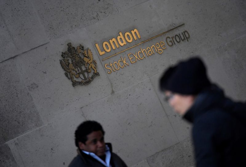 &copy; Reuters. FILE PHOTO:  People walk past the London Stock Exchange Group offices in the City of London, Britain, December 29, 2017. REUTERS/Toby Melville/File photo