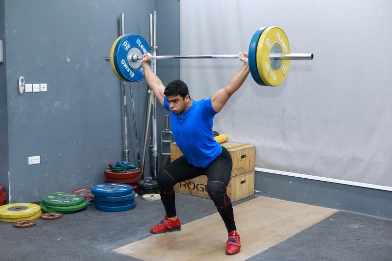 &copy; Reuters. الرباع الفلسطيني محمد حمادة يتدرب في الدوحة يوم 18 يوليو تموز 2021 قبل السفر إلى أولمبياد طوكيو. رويترز