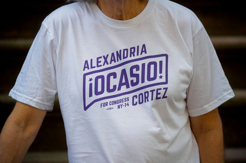 &copy; Reuters. Peter Hogness poses wearing his Alexandria Ocasio-Cortez branded T-shirt in the Park Slope area of Brooklyn in New York City, U.S., July 16, 2021.  REUTERS/Brendan McDermid