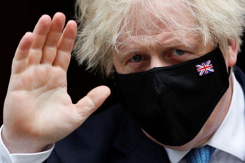 &copy; Reuters. Britain's Prime Minister Boris Johnson waves, as he walks on Downing Street in London, Britain, July 14, 2021. REUTERS/Peter Nicholls