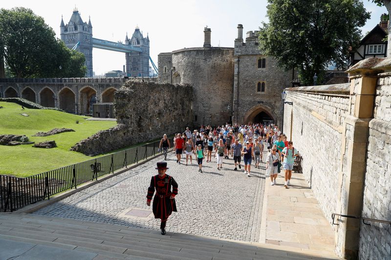 © Reuters. A Yeoman Warder, Barney Chandler leads the first 