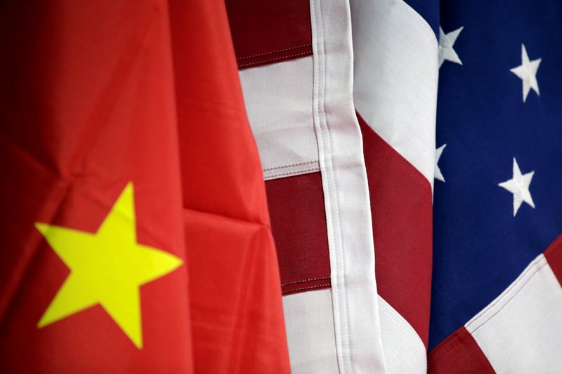 &copy; Reuters. Flags of U.S. and China are displayed at American International Chamber of Commerce (AICC)'s booth during China International Fair for Trade in Services in Beijing, China, May 28, 2019. REUTERS/Jason Lee