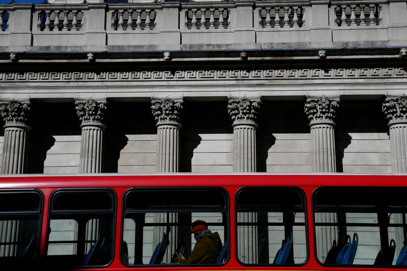 &copy; Reuters. FILE PHOTO: A quiet bus passes the Bank of England, as the spread of the coronavirus disease (COVID-19) continues, in London, Britain, March 23, 2020. REUTERS/Toby Melville//File Photo