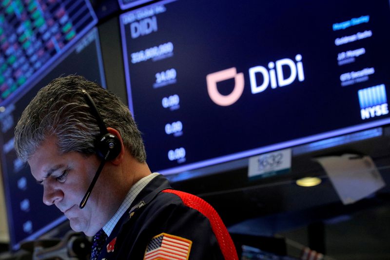 &copy; Reuters. FILE PHOTO: A trader works during the IPO for Chinese ride-hailing company Didi Global Inc on the New York Stock Exchange (NYSE) floor in New York City, U.S., June 30, 2021.  REUTERS/Brendan McDermid/File Photo