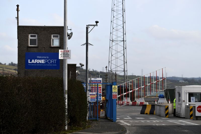 &copy; Reuters. FILE PHOTO: A sign is seen with a message against the Brexit border checks in relation to the Northern Ireland protocol at the harbour in Larne, Northern Ireland February 12, 2021. REUTERS/Clodagh Kilcoyne