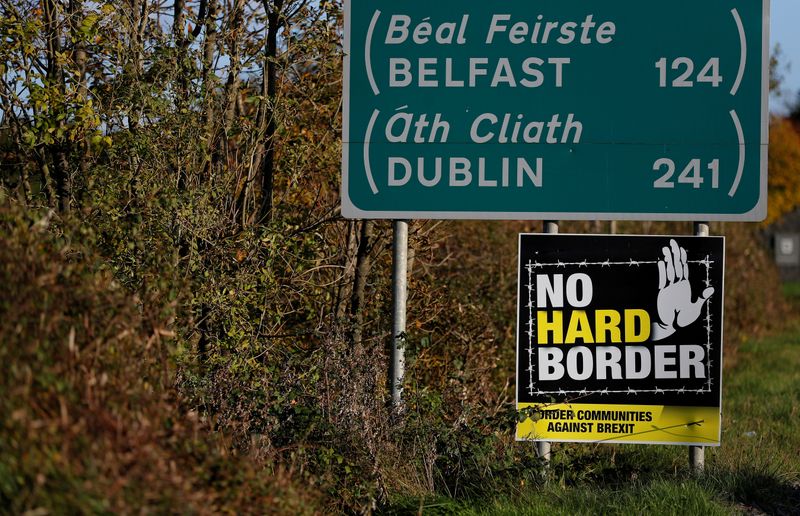 &copy; Reuters. FILE PHOTO: A 'No Hard Border' poster is seen below a road sign on the Irish side of the border between Ireland and Northern Ireland near Bridgend, Ireland October 16, 2019. Picture taken October 16, 2019. REUTERS/Phil Noble/File Photo