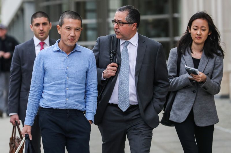 &copy; Reuters. Ex-Goldman Sachs banker Roger Ng and his lawyer Marc Agnifilo leave the federal court in New York, U.S., May 6, 2019. REUTERS/Jeenah Moon/Files