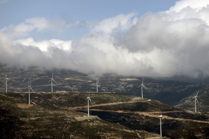 © Reuters. Wind turbines are seen on a mountain near the town of Karystos, on the island of Evia, Greece, April 16, 2021. Picture taken with a drone on April 16, 2021. REUTERS/Alkis Konstantinidis