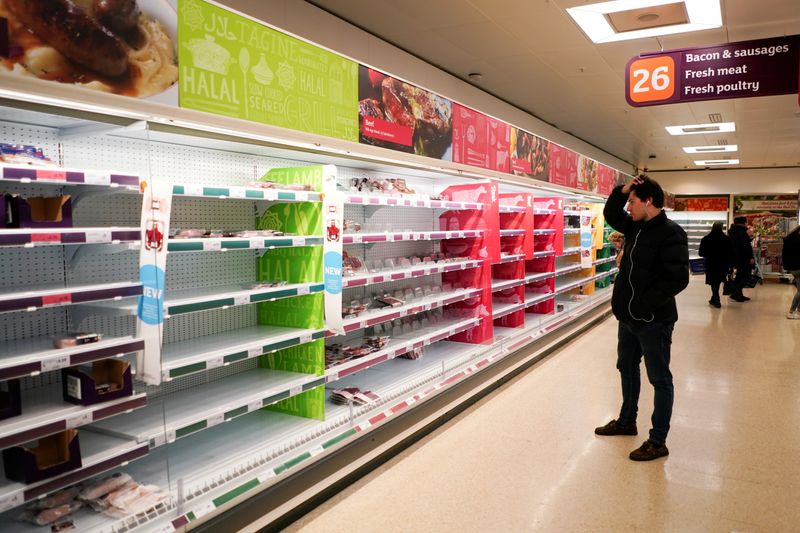 &copy; Reuters. FILE PHOTO: A man stands next to shelves empty of fresh meat in a supermarket, as the number of worldwide coronavirus cases continues to grow,  in London, Britain, March 15, 2020. REUTERS/Henry Nicholls//File Photo