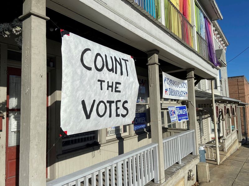 &copy; Reuters. FILE PHOTO: A sign urging people to vote is seen on the porch of the Democratic Party's Fulton County headquarters on Election Day in McConnellsburg, Pennsylvania November 3, 2020. REUTERS/Nathan Layne/File Photo