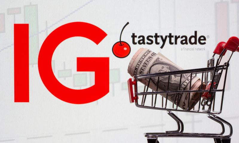 &copy; Reuters. FILE PHOTO: A shopping cart with U.S. one dollar banknote is seen in front of displayed British IG trade and Tastytrade logos in this illustration taken January 21, 2021. REUTERS/Dado Ruvic/Illustration/File Photo