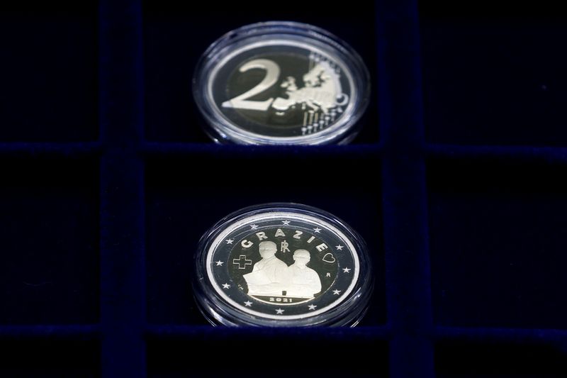 &copy; Reuters. A 2 euro coin commemorating the role of health workers during the coronavirus disease (COVID-19) pandemic is displayed at the Italian Mint, in Rome, Italy, January 21, 2021. REUTERS/Guglielmo Mangiapane