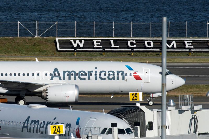 &copy; Reuters. FILE PHOTO: American Airlines flight 718, the first U.S. Boeing 737 MAX commercial flight since regulators lifted a 20-month grounding in November, lands at LaGuardia airport in New York, U.S. December 29, 2020.  REUTERS/Eduardo Munoz/File Photo