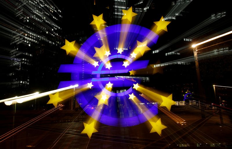 &copy; Reuters. FILE PHOTO: The euro sign is photographed in front of the former head quarter of the European Central Bank in Frankfurt, Germany, April 9, 2019. Picture is taken on slow shutter speed while zooming.  REUTERS/Kai Pfaffenbach/File Photo