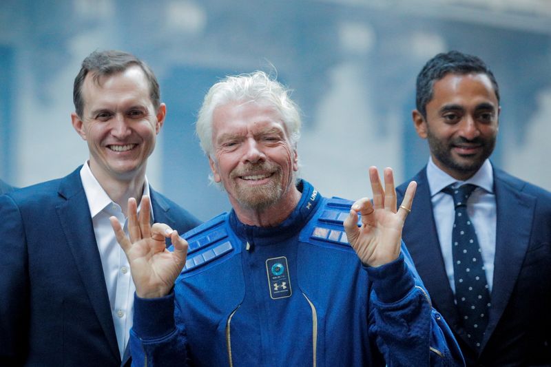 &copy; Reuters. FILE PHOTO: Virgin Galactic co-founder Sir Richard Branson, CEO George Whitesides and Social Capital CEO Chamath Palihapitiya pose together outside of the New York Stock Exchange n New York, U.S., October 28, 2019. REUTERS/Brendan McDermid