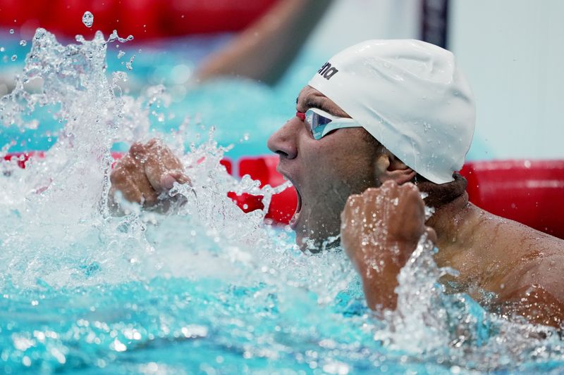 &copy; Reuters. Ahmed Hafnaoui comemora vitória nos 400m livre
25/07/2021
REUTERS/Aleksandra Szmigiel