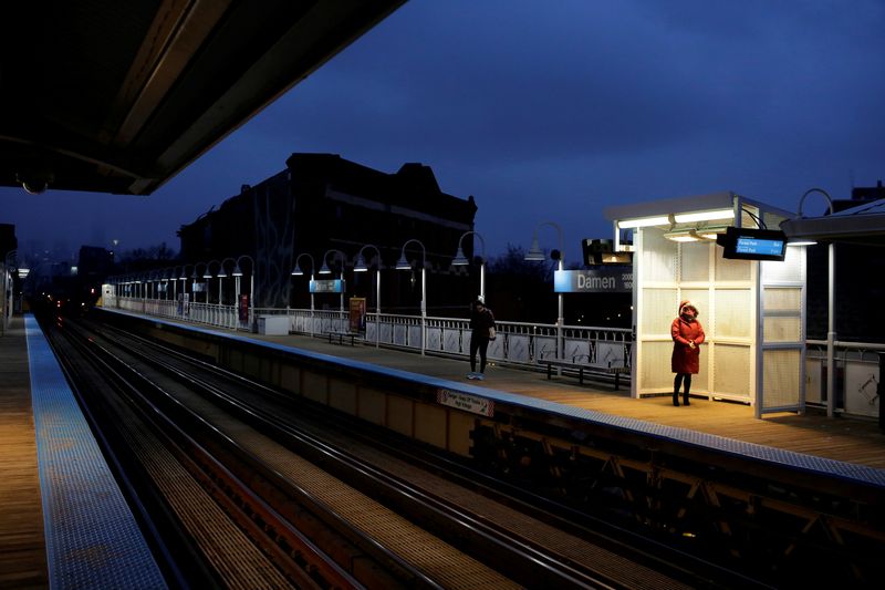 &copy; Reuters. FILE PHOTO: Commuters wait for the Chicago Transit Authority Blue line train at the Damen Avenue stop in Chicago, Illinois, U.S. March 16, 2020. REUTERS/Joshua Lott/File Photo