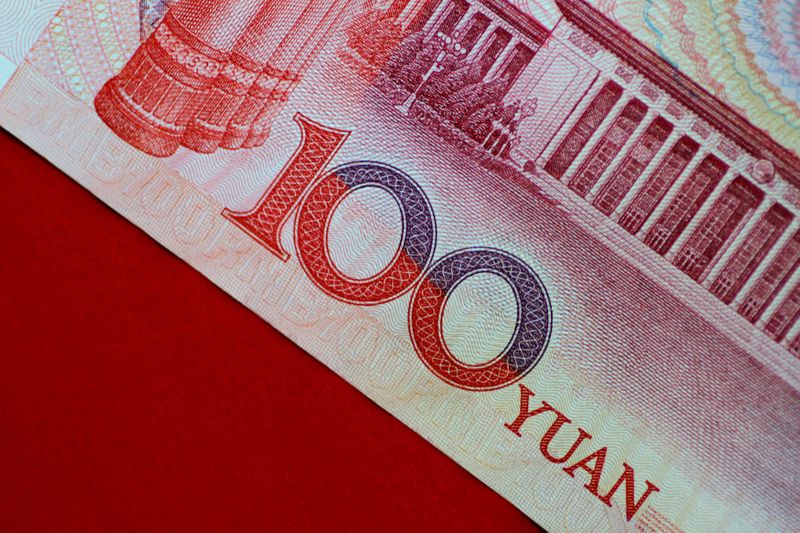 &copy; Reuters. FILE PHOTO: A China yuan note is seen in this illustration photo May 31, 2017.  REUTERS/Thomas White