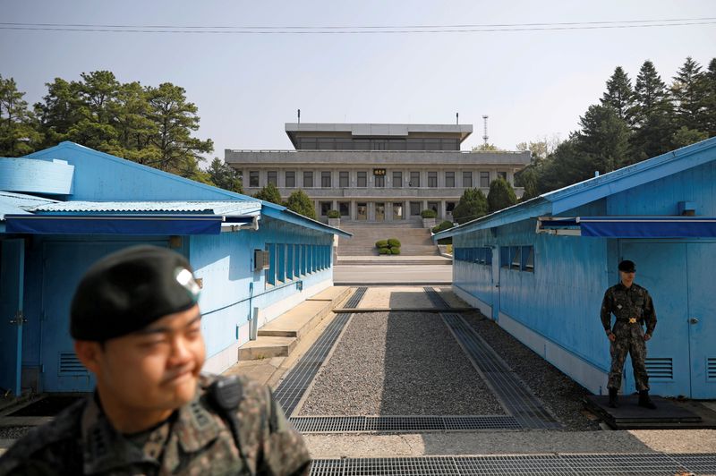 &copy; Reuters. FILE PHOTO: South Korean soldiers stand guard at the truce village of Panmunjom inside the demilitarized zone (DMZ) separating the two Koreas, South Korea, May 1, 2019.    REUTERS/Kim Hong-Ji