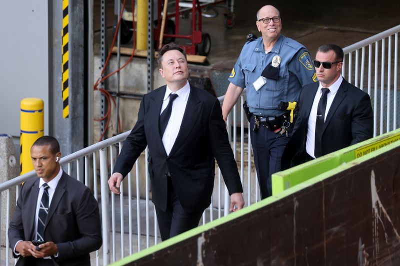 &copy; Reuters. Tesla CEO Elon Musk reacts to onlookers as he departs after taking the stand to defend Tesla Inc's 2016 deal for SolarCity in a case before the Delaware Court of Chancery in Wilmington, Delaware, U.S. July 12, 2021. REUTERS/Jonathan Ernst