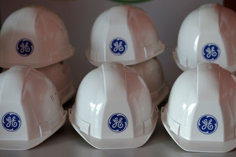 &copy; Reuters. FILE PHOTO: The General Electric logo is pictured on working helmets during a visit at the General Electric offshore wind turbine plant in Montoir-de-Bretagne, near Saint-Nazaire, western France, November 21, 2016. REUTERS/Stephane Mahe/File Photo