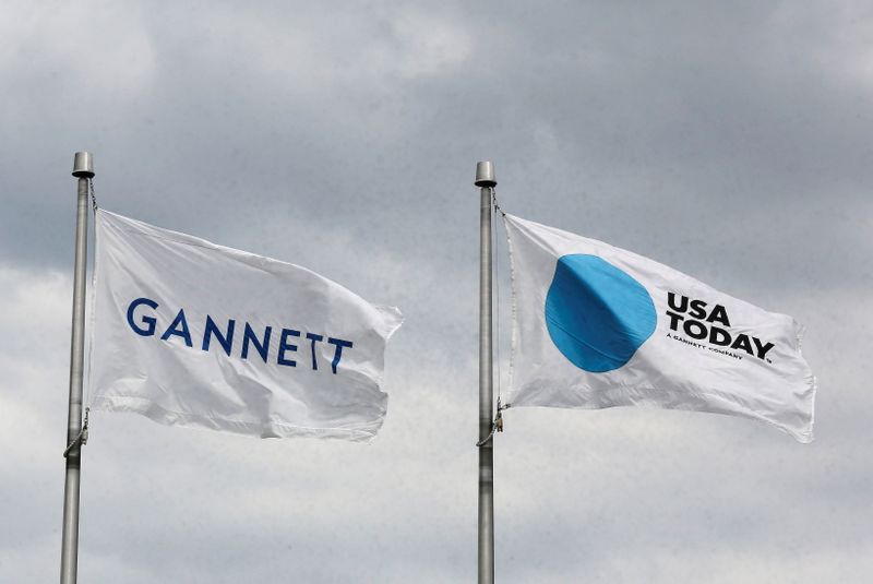 &copy; Reuters. FILE PHOTO: The corporate flags for the Gannett Co and its flagship newspaper, USA Today, fly outside their corporate headquarters in McLean, Virginia, July 23, 2013. REUTERS/Larry Downing  (UNITED STATES/File Photo