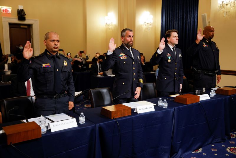 &copy; Reuters. U.S. Capitol Police sergeant Aquilino Gonell; Washington DC Metropolitan Police Department officers Michael Fanone and Daniel Hodges, and U.S. Capitol Police Officer Harry Dunn are sworn in to testify during the opening hearing of the U.S. House (Select) 