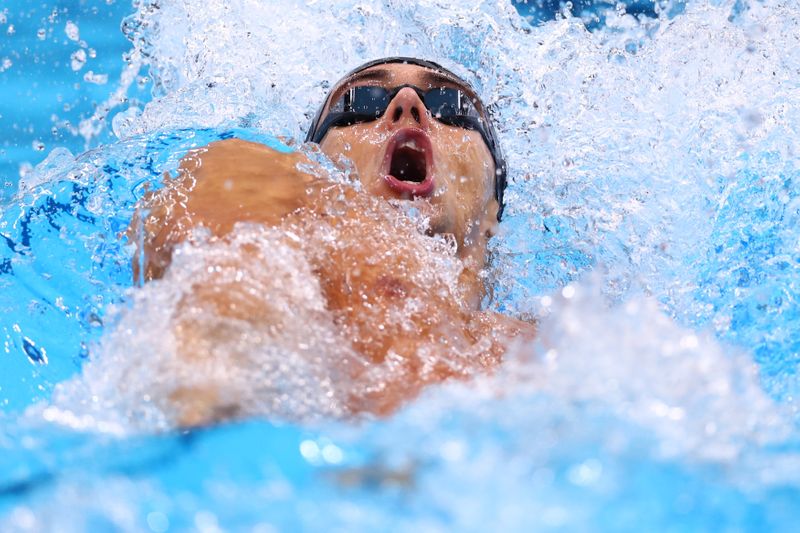 © Reuters. توماس تشيكون يشارك في الدور قبل النهائي لسباق 100 متر حرة في منافسات السباحة بأولمبياد طوكيو يوم الثلاثاء. تصوير: كاي فافنباخ - رويترز.