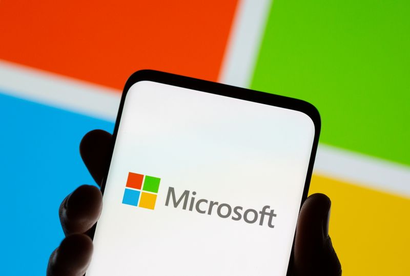 &copy; Reuters. FILE PHOTO: Smartphone is seen in front of Microsoft logo displayed in this illustration taken, July 26, 2021. REUTERS/Dado Ruvic/Illustration