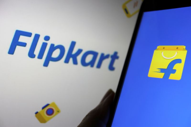 &copy; Reuters. FILE PHOTO: A mobile phone showing the logo of Indian online retailer Flipkart is seen in front of its sign displayed in this illustration picture taken July 14, 2021. REUTERS/Florence Lo/Illustration