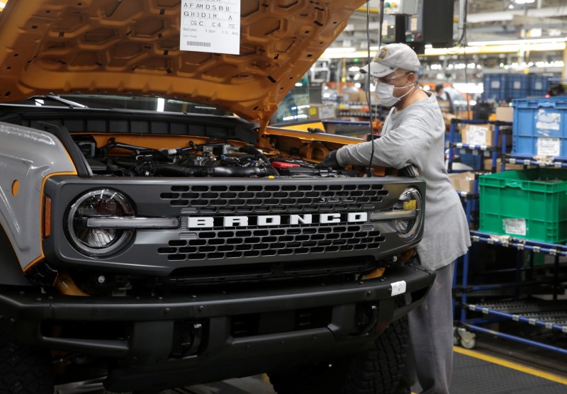 &copy; Reuters. A Ford Motor assembly worker works on a 2021 Bronco SUV at Michigan Assembly Plant in Wayne, Michigan, U.S., June 14, 2021.   Picture taken June 14, 2021.  REUTERS/Rebecca Cook