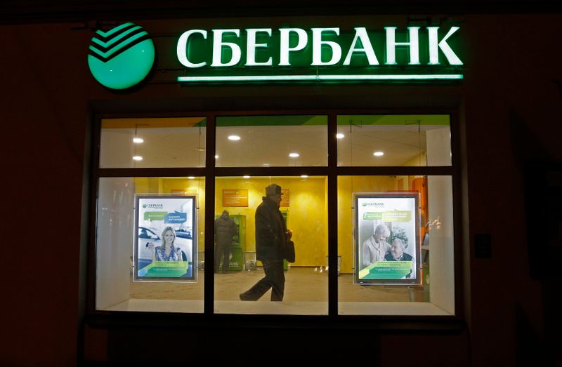 &copy; Reuters. A man walks inside a branch of Sberbank in St. Petersburg, February 4, 2013. Russian lender Sberbank reported net profit up 9 percent year on year in January at 31.8 billion roubles ($1.1 billion), according to Russian Accounting Standards (RAS), on the b