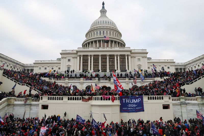 &copy; Reuters. FILE PHOTO: Supporters of U.S. President Donald Trump gather in front of the U.S. Capitol Building in Washington, U.S., January 6, 2021. REUTERS/Leah Millis/File Photo