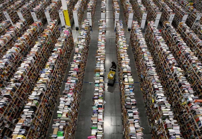 &copy; Reuters. FILE PHOTO: A worker gathers items for delivery from the warehouse floor at Amazon's distribution center in Phoenix, Arizona November 22, 2013.  REUTERS/Ralph D. Freso/File Photo 